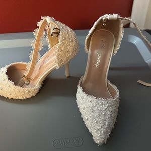 Wedding shoes, never worn.  1 pair of heels and matching sneakers